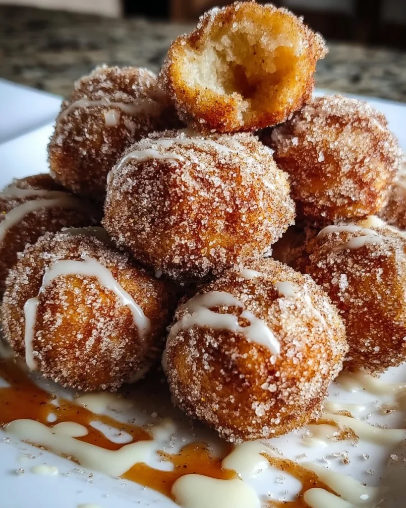 Delicious Cinnamon Sugar Biscuit Bites on a plate garnished with cinnamon dust