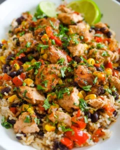 Cilantro lime chicken served with rice on a plate garnished with lime slices