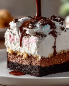 Homemade copycat Dairy Queen ice cream cake decorated with chocolate frosting