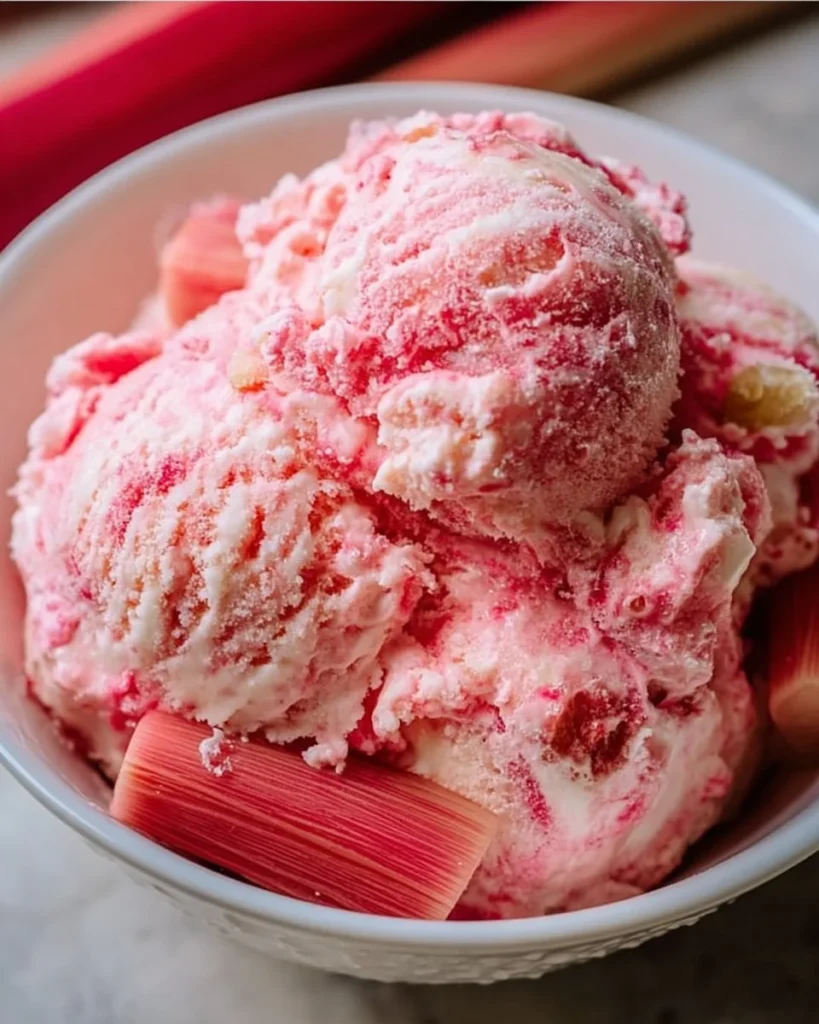 Delicious homemade rhubarb ice cream in a scoop