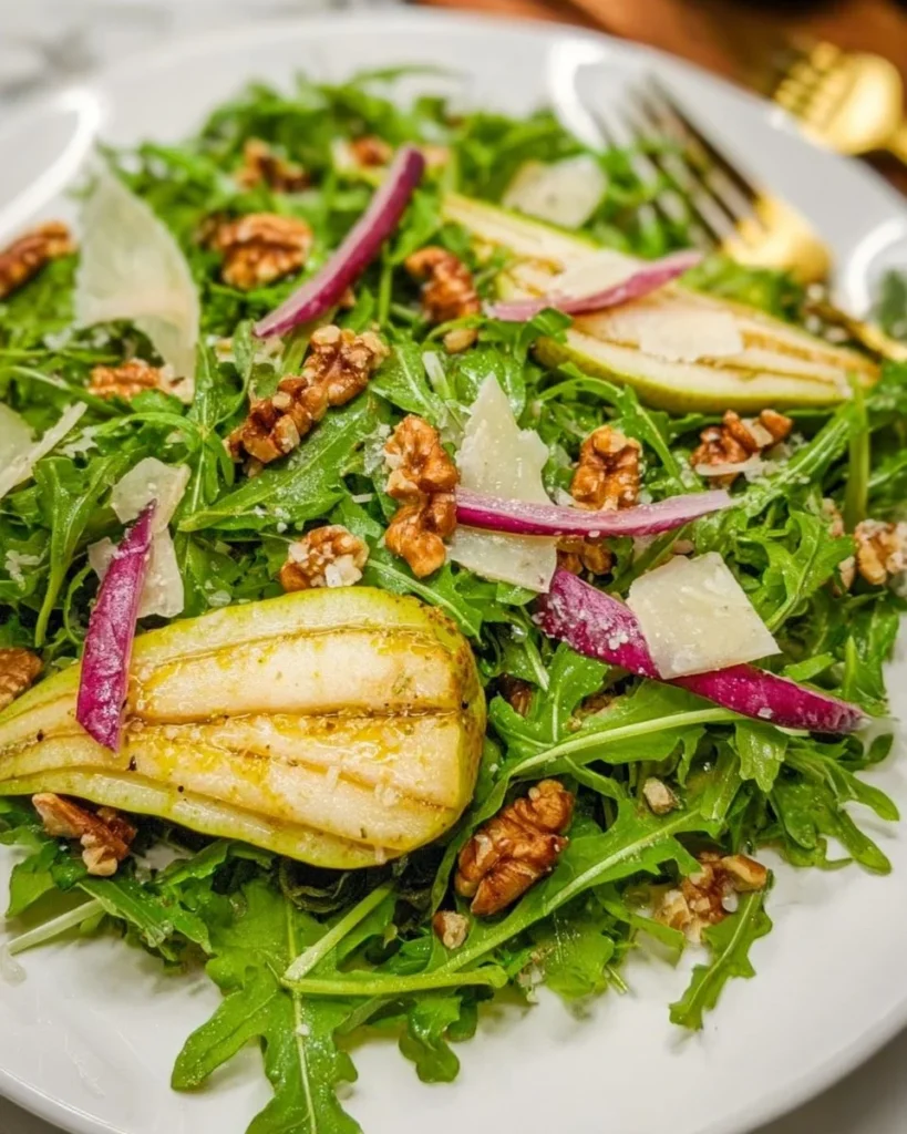 Arugula pear salad with fresh greens and sliced pears