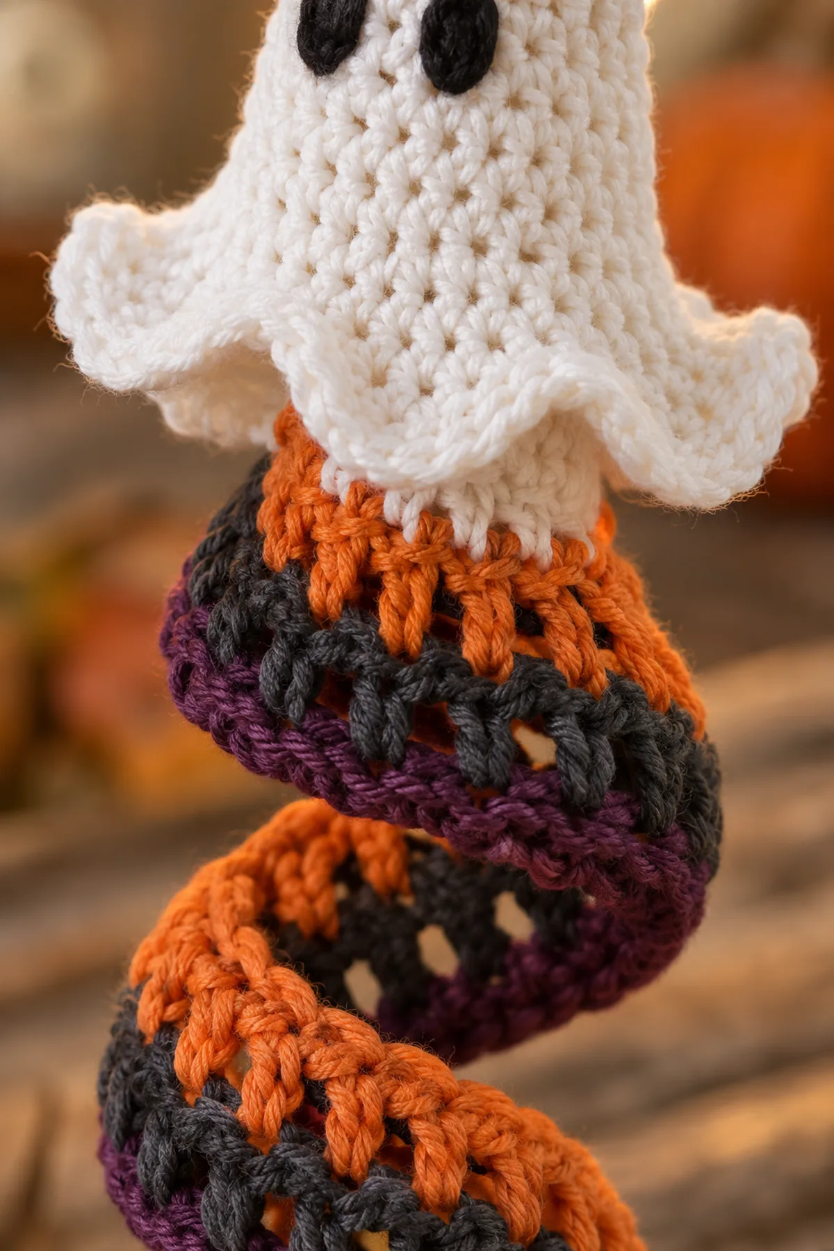 Close view of the secure join between the crochet ghost and striped spiral.